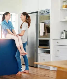 Appliance repair in Arlington WA - technician fixing refrigerator